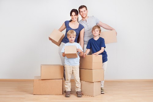 Professional Shoreditch movers handling packed boxes and furniture