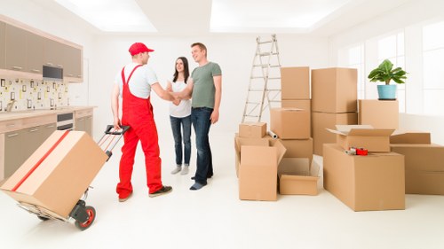 Moving company staff checking service records after a complaint