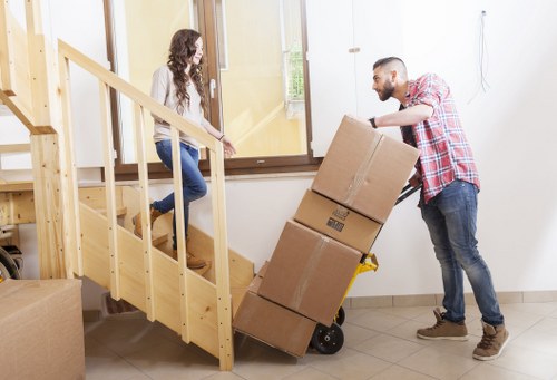 Shoreditch moving professionals handling boxes and fragile items with care